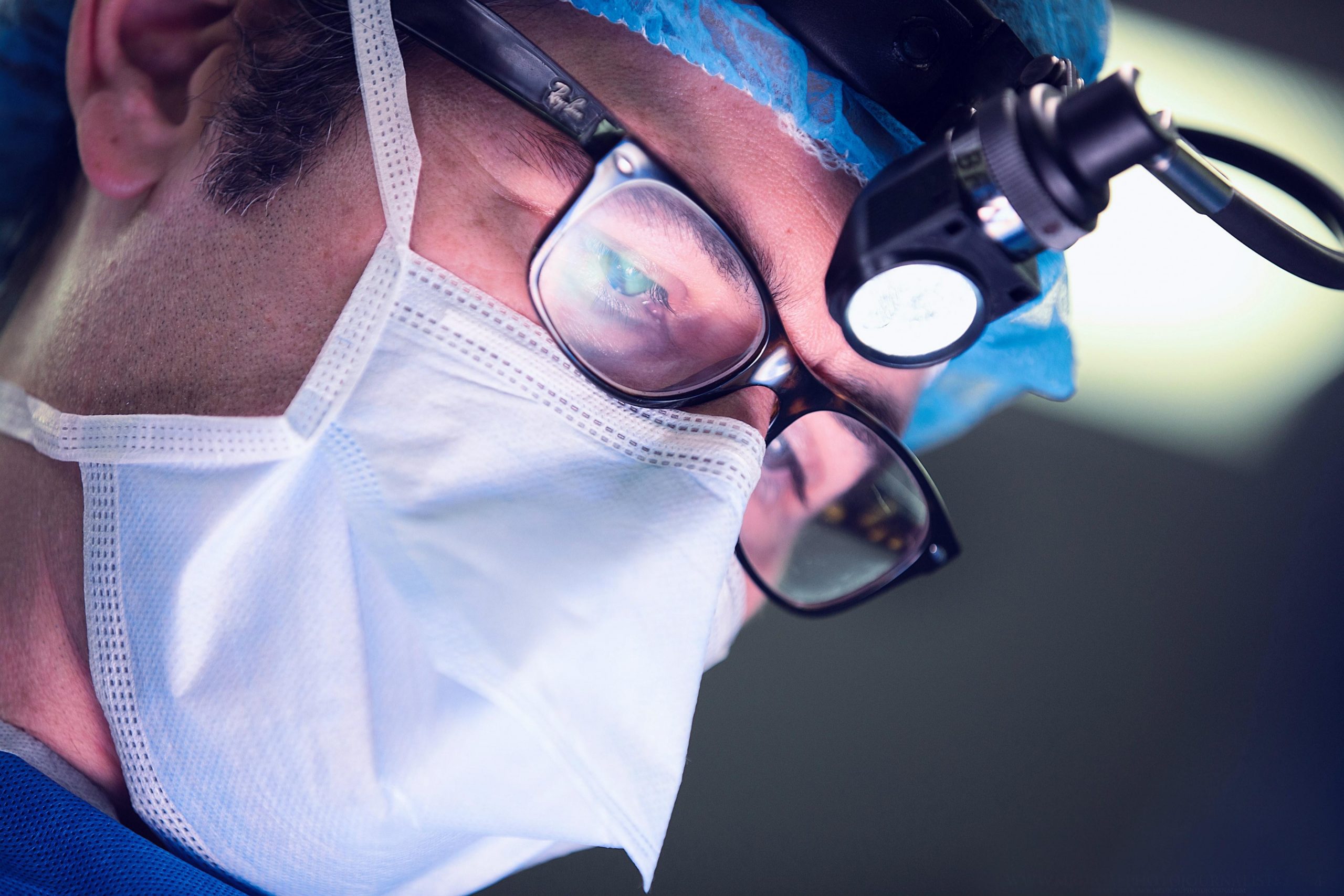 Dr. Cohen in surgical loupes, thyroid and parathyroid surgeon now serving Florida